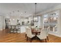 Open dining area with a modern chandelier, white trim, large windows, and seamless access to the kitchen at 2871 Parkridge Ne, Brookhaven, GA 30319