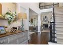 Elegant foyer with hardwood floors, a staircase with dark railings, and views into the inviting living room at 1021 Bluffhaven Ne Way, Atlanta, GA 30319