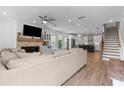 Spacious living room with fireplace, wet bar, and open layout to the kitchen at 300 Olmstead Way, Alpharetta, GA 30022