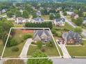 Expansive lot with a beautiful brick home, mature trees, and a long driveway in a quiet neighborhood at 1032 Jordan Rd, Dacula, GA 30019