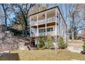 Backyard view of a two-story home featuring double balconies and a retaining wall at 625 Home Se Ave, Atlanta, GA 30312