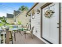 Inviting deck area, perfect for outdoor dining and relaxation with comfortable seating and pleasant views at 1029 Megan Ct, Sugar Hill, GA 30518