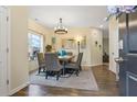 Inviting dining room with wood floors, stylish chandelier, and comfortable seating for elegant meals at 59 Summer Nw Pl, Cartersville, GA 30121