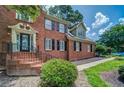 Elegant brick home with a welcoming front entrance and beautifully landscaped surroundings at 1885 Vintage Dr, Snellville, GA 30078