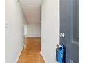 Inviting hallway featuring sleek, recently polished wood flooring at 3980 Riverlook Se Pkwy # 203, Marietta, GA 30067
