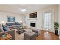 Spacious living room with a cozy fireplace and ample natural light at 3980 Riverlook Se Pkwy # 203, Marietta, GA 30067