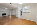 Open-concept living room featuring a fireplace, adjacent to the kitchen at 3980 Riverlook Se Pkwy # 203, Marietta, GA 30067