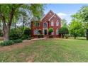 Charming two-story brick home with manicured landscaping and a well-maintained lawn at 1720 Greystone Trce, Conyers, GA 30013
