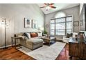 Spacious living room with vaulted ceilings, a ceiling fan, and large windows offering natural light at 955 Juniper Ne St # 2322, Atlanta, GA 30309