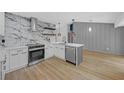 Modern kitchen with stainless steel appliances, custom cabinetry, and elegant backsplash at 4336 Southvale Dr, Decatur, GA 30034