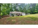 Lovely home featuring a classic design, a large front lawn, and a fenced yard for added privacy at 2849 Appling Way, Kennesaw, GA 30152