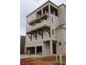 Features multiple levels of balconies and a garage below at 9244 Main Street # 102, Woodstock, GA 30188