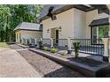 Charming home with black railings and landscaped garden beds, offering a welcoming curb appeal at 2023 Stoneleigh Dr, Stone Mountain, GA 30087
