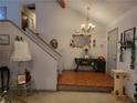 Home entryway with high ceilings, wood and carpet floors, and staircase to the second floor at 3723 Raiders Ridge Dr, Lithonia, GA 30038