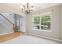 Inviting dining room with a large window allowing for lots of natural light at 5512 Village Rdg, Fairburn, GA 30213