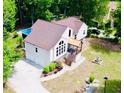 Aerial view of the home showcasing its updated roof, the inviting pool, and private backyard oasis at 3748 Woodrose Ct, Snellville, GA 30039
