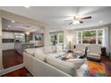 Bright, open living room with a modern kitchen, large windows, and comfortable seating at 299 Stockwood Dr, Woodstock, GA 30188
