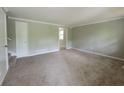 Bright living room with neutral carpet and paint, ready for your personal touches at 4063 Feather Dr, Douglasville, GA 30135