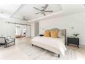 Serene main bedroom featuring ample space, neutral tones, and ceiling fans, offering a tranquil retreat at 50 Dartmouth Ave, Avondale Estates, GA 30002