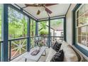 Relaxing covered front porch with stylish furniture, offering a serene outdoor space to enjoy the view at 50 Dartmouth Ave, Avondale Estates, GA 30002