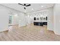 Open living area featuring hardwood floors, recessed lighting, and an open concept to the kitchen at 2402 Lynn Iris Dr, Decatur, GA 30032