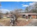 View of single-story home, showcasing stone mailbox, yard, and exterior brick at 2807 Knollview Dr, Decatur, GA 30034