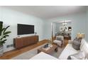 Bright living room with hardwood floors, neutral paint, and plenty of natural light at 1901 Trophy Dr, Marietta, GA 30062