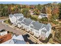 Aerial view of a neighborhood featuring townhomes, showcasing the layout, landscaping, and community setting at 2035 Parkside Ln, Roswell, GA 30076