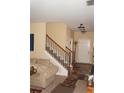 Neutral foyer showcases a staircase, front door, and adjacent living area at 504 Liverpool Dr, Mcdonough, GA 30252