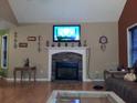 Cozy living room with a fireplace, decorative accents, and plenty of space for relaxation and entertainment at 22 Briar Chase Ct, White, GA 30184