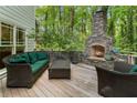 Inviting outdoor space with a stone fireplace and comfortable seating area at 601 Ashley Forest Nw Dr, Acworth, GA 30102