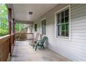 Charming porch with rocking chairs, providing a relaxing outdoor space at 556 Auburn Rd, Auburn, GA 30011