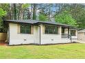 Well-maintained home with painted brick, new wooden shutters, and manicured front lawn at 117 Hillsdale Dr, Atlanta, GA 30315