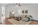 Inviting living room with hardwood floors, neutral decor, comfortable seating, and lots of natural light at 3562 Greenwich Ave, Duluth, GA 30096