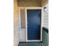 Blue front door with sidelight, unit number 303, and white trim welcomes visitors at 3575 Oakvale Road # 303, Decatur, GA 30034