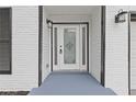 A close-up view of the front door, featuring a decorative glass panel and classic hardware at 285 Camden Park Dr, Lawrenceville, GA 30046
