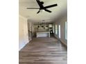 Open-concept living area showcasing hardwood floors, a modern kitchen, and plenty of natural light at 3036 Zodiac Ct, Lawrenceville, GA 30044