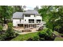 Amazing backyard with pool, hot tub, patio, lounging, and outdoor dining areas at 520 Flying Scot Way, Alpharetta, GA 30005