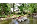 Beautiful waterfront home with a dock ready for boating and enjoying lake activities at 520 Flying Scot Way, Alpharetta, GA 30005