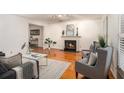 Cozy living room with a fireplace, hardwood floors, and stylish decor at 2360 Elon Way, Decatur, GA 30033