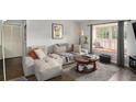 Cozy living room featuring a comfortable sofa, area rug, and a bright window seat at 133 Maison Nw Pl, Atlanta, GA 30327