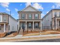 Charming two-story brick home with symmetrical windows and a welcoming front porch at 173 Basil St, Cumming, GA 30040