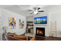 Bright living space features a fireplace, hardwood floors, and open concept living at 4925 Longview Walk, Decatur, GA 30035