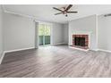 Bright living room with sliding glass door to the outside and brick fireplace at 2930 Parc Lorraine, Lithonia, GA 30038