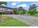 Long driveway leading to a spacious two-car garage with well maintained exterior at 2272 Plantation Ct, Lawrenceville, GA 30044