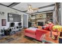 Cozy living room featuring a fireplace, custom built-ins, and comfortable seating at 2272 Plantation Ct, Lawrenceville, GA 30044