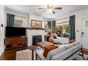 Cozy living room with fireplace, hardwood floors, neutral color palette, and lots of natural light at 509 Rankin Ne St, Atlanta, GA 30308