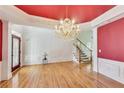 Elegant dining room with a crystal chandelier, hardwood floors, and decorative trim at 2119 Wrights Mill Ne Cir, Atlanta, GA 30324
