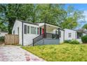 Street view of the house with red front door and landscaped yard at 248 Upshaw Sw St, Atlanta, GA 30315