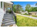 Street view of house showing front porch and manicured lawn at 248 Upshaw Sw St, Atlanta, GA 30315